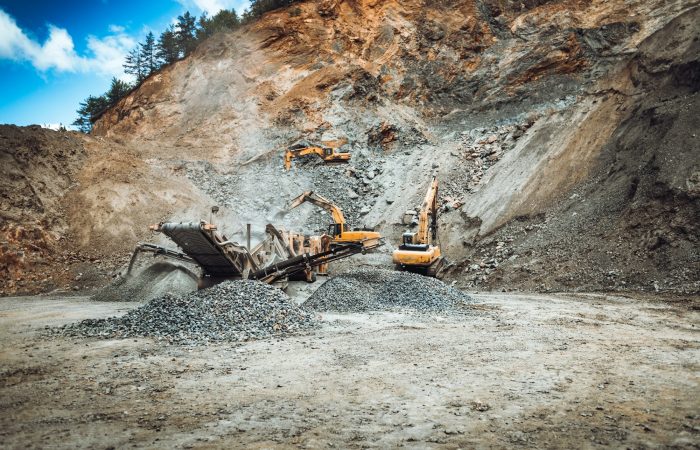 Ground Treasures Achieves Milestone in Environmental Sustainability Efforts 3 Iron mine, quarry, iron ore mining details. Industrial machinery working with rock breaker